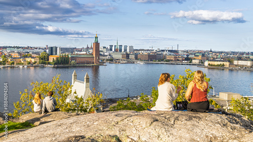 Stockholm, Sweden: Families and friends overlooking the cityscape from a rocky overlook by the water