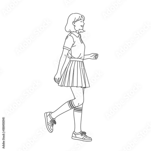 Young woman in pleated skirt and polo shirt walking with a smile.