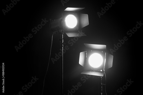 Glowing studio light on bla...