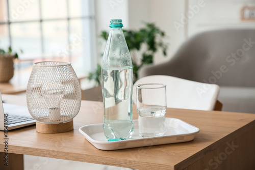 Bottle of water on table in...