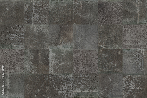 black grunge blocks background.Old cement squares wallpaper