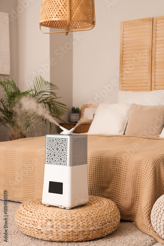 Modern air humidifier on po...