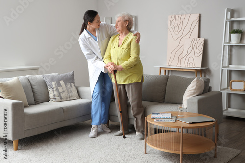 Senior woman with stick and...