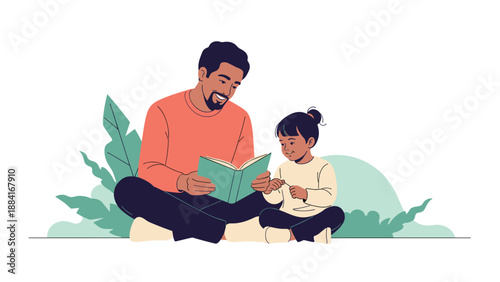 Caring father sits on the ground and reads an interesting book to his young daughter in a peaceful outdoor setting with green foliage.