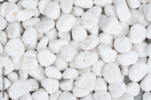 small smooth waterworn white pebbles or stones for use decor and garden landscaping. tone garden interiors. stone spa