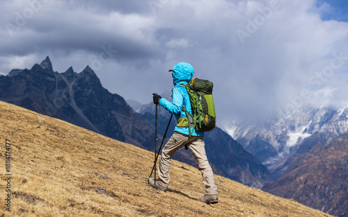 Wallpaper Mural Backpacking woman hiking on high altitude mountain top Torontodigital.ca