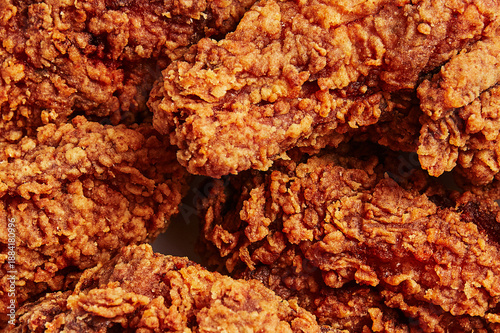 Close-up Macro View of Crispy Deep-Fried Chicken Tenders Background Texture