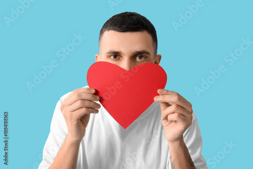 Young man with red paper he...