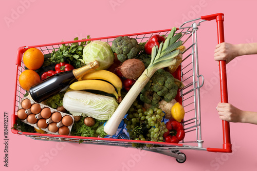 Woman pushing shopping cart...