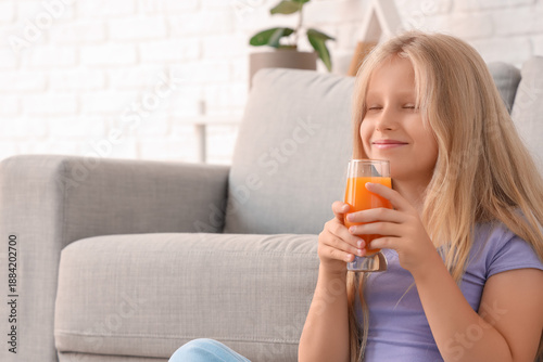 Little girl with glass of j...