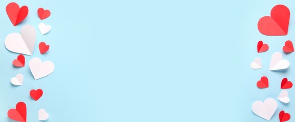 Different paper hearts on blue background with space for text. Valentine's Day celebration