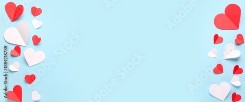 Different paper hearts on blue background with space for text. Valentine's Day celebration