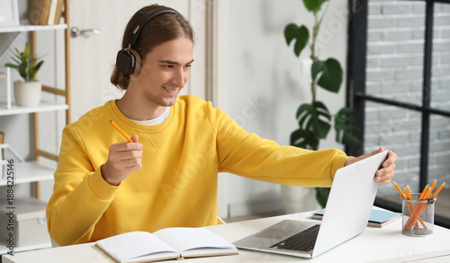 Young man in headphones, wi...