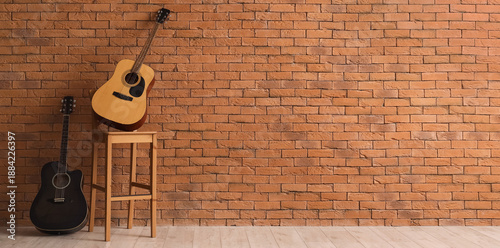 Different guitars on chair ...