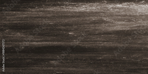 Aged dark grunge paper texture background with a vintage brown wooden board pattern and rough textured surface material for a weathered wall backdrop