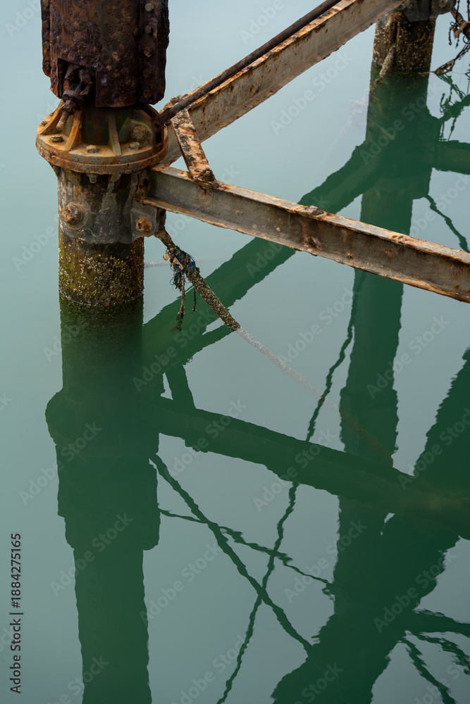Fototapeta premium The lower reaches of the Tinto Wharf in Huelva. Metal pillars in the water