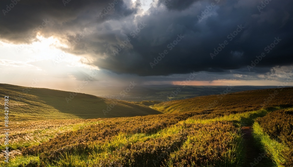 Fototapeta premium Dramatic Stormy Landscape With Dark Clouds And Sunbeams Breaking Through