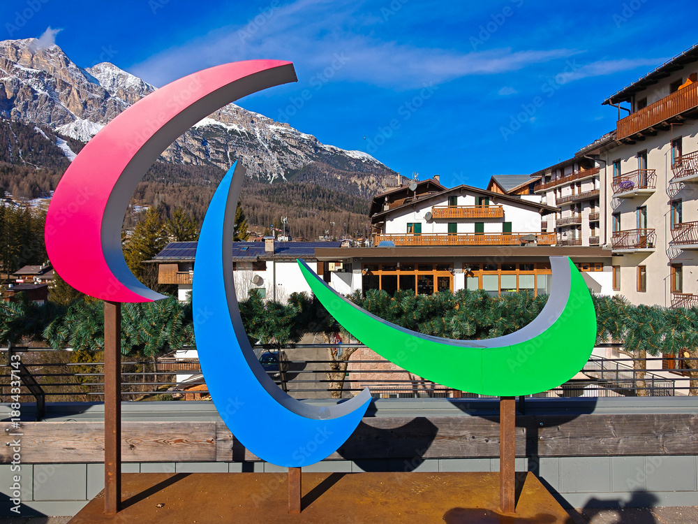 Fototapeta premium CORTINA D'AMPEZZO, ITALY - JANUARY 22, 2025: Pink and blue Paralympic 