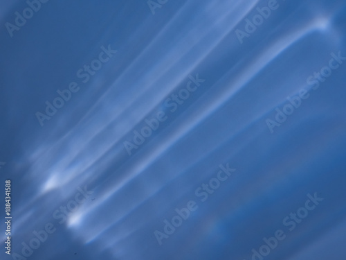 Abstract photograph of light reflections on a smooth surface, creating a powerful yet minimalist visual expression. Ideal for modern branding, technology concepts, corporate design