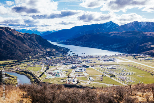 The view over Queenstown Airport from the Remarkables on a sunny spring day in New Zealand