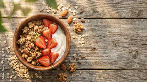 Healthy granola breakfast bowl with fresh strawberry