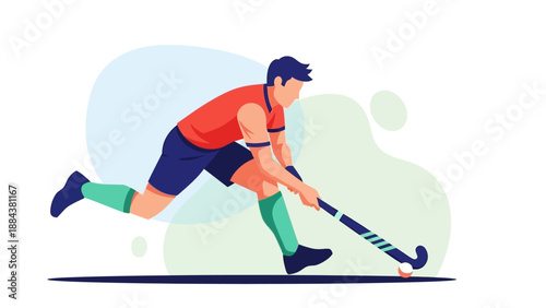 Man playing field hockey with stick and ball in action.