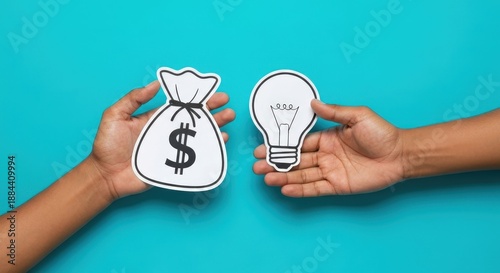 Hands Holding Money Bag and Light Bulb Against Blue Background for Conceptual Ideas