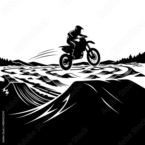 Dirt bike rider jumping over dunes