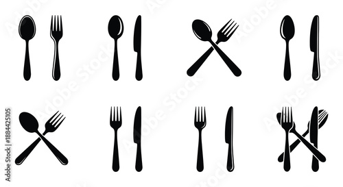 A collection of black silhouette cutlery forks spoons and knives arranged neatly