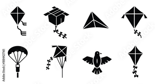 Collection of black silhouette icons depicting kites a parachute and a bird