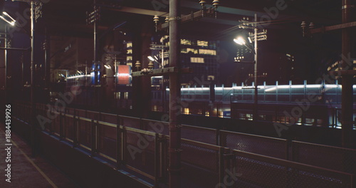 Canvas-taulu Empty urban train platform at night, passing train lights blur into neon streaks