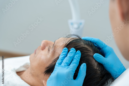 Canvas Print Specialist of hair check health of hair for Asian man, damaged hair, hair loss,