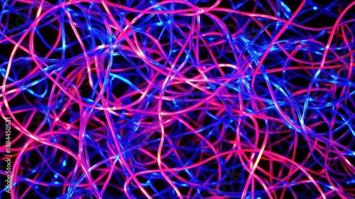 Abstract, vibrant, tangled lines of pink and blue light on a black background