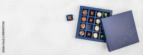 Luxury chocolate gift box with lid and copy space on white background