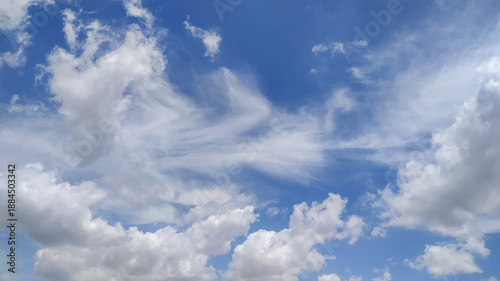 Blue sky with white clouds stock photo.
