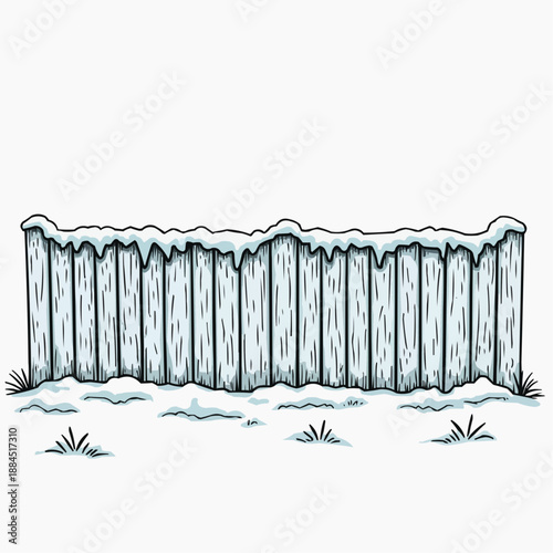 Wooden fence covered in snow with grassy area in winter scene  