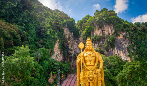 Statue of Lord Muragan and entrance with blue sky in Batu Caves, Kuala Lumpur, Malaysia.