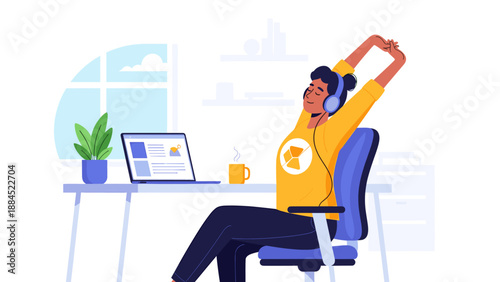 A person wearing headphones stretches at their desk while working on a laptop.