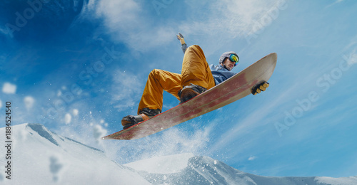 Foto Snowboarder in action. Extreme winter sports.