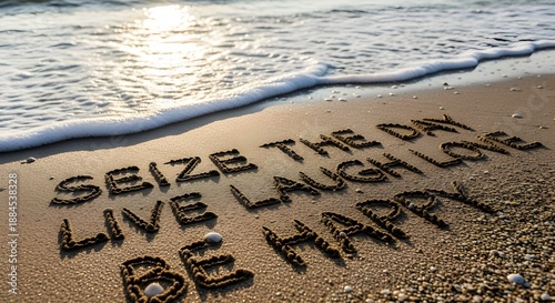 Motivational message seize the day live laugh love and be happy written in wet sand at sunset
