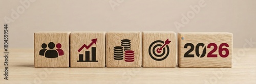 Vision of 2026: Wooden blocks showcase business goals, highlighting teamwork, growth, and targets for the year 2026, set against a neutral backdrop.