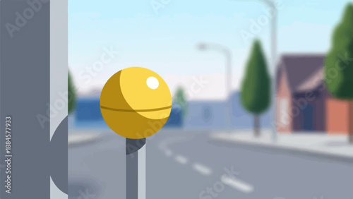 Yellow sphere on pole beside road with houses and trees in background