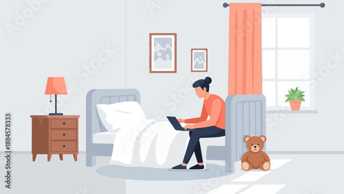 Person working on laptop in bedroom with teddy bear