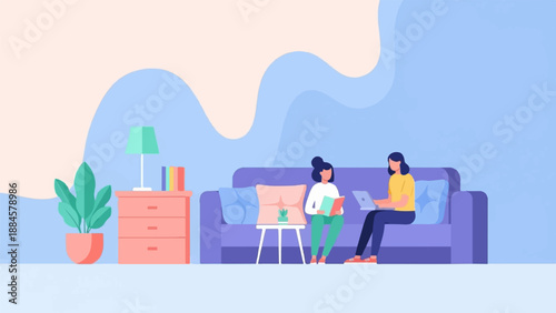 Two women in a living room, one reading a book, the other on a laptop