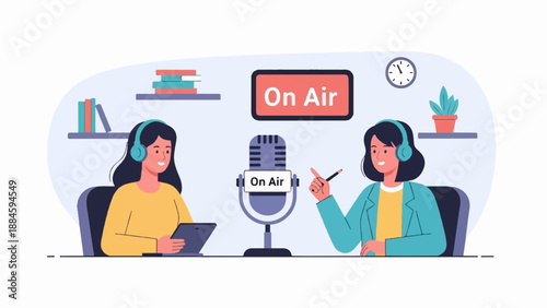 Two women in headphones record a podcast with a microphone and tablet