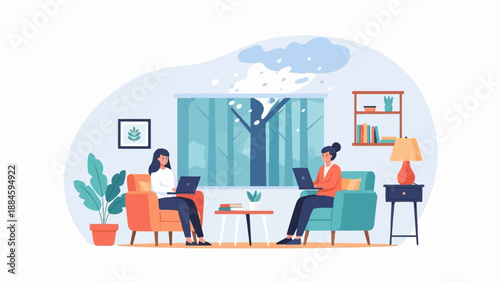 Two women work on laptops in a cozy room with a snowy winter scene outside