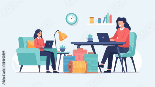 Two women working on laptops in a room with sewing supplies and plants