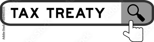 Search banner in word tax treaty with hand over magnifier icon on white background