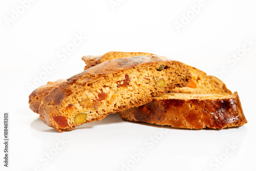 Italian cantucci cookies with nuts and candied fruits on a white background