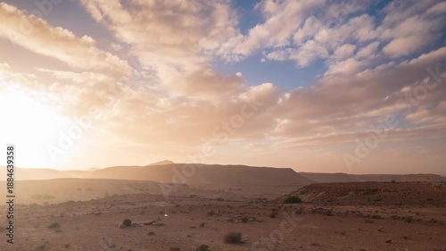 Timelapse: dramatic cloudy sky at sunset in Dahar mountains desert landscape in southern Tunisia, arid plateau, remote wilderness, Sahara fringe, travel destination, Ghomrassen, Africa
